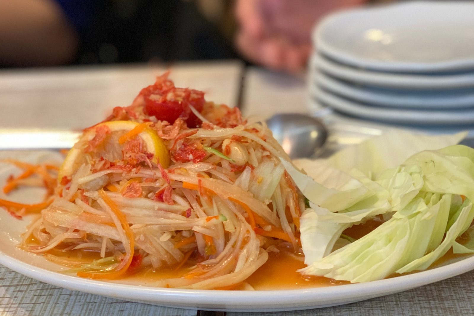 A plate of som tam, green papaya salad, served at a Flight in Ebisu