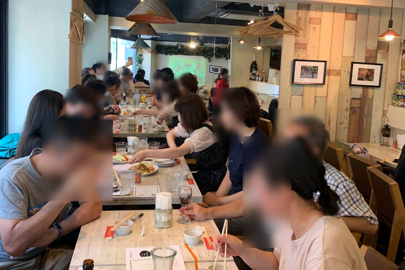 Passengers at long tables at a LunchTrip Japan Flight in a Thai restaurant in Ebisu, Tokyo